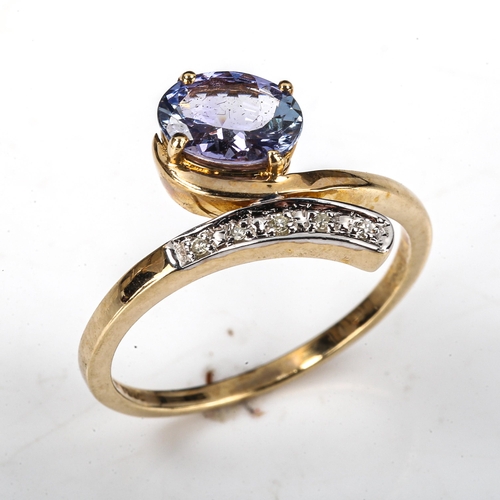 502 - A modern 9ct gold tanzanite and diamond crossover ring, setting height 13.1mm, size N, 2.2g