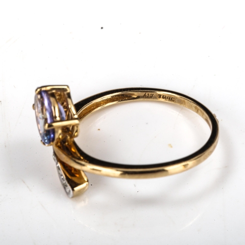 502 - A modern 9ct gold tanzanite and diamond crossover ring, setting height 13.1mm, size N, 2.2g