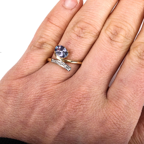 502 - A modern 9ct gold tanzanite and diamond crossover ring, setting height 13.1mm, size N, 2.2g