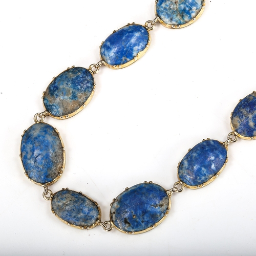 504 - A sodalite line bracelet, unmarked gold settings test as 18ct, bracelet length 18cm, 13.5g