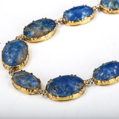 504 - A sodalite line bracelet, unmarked gold settings test as 18ct, bracelet length 18cm, 13.5g