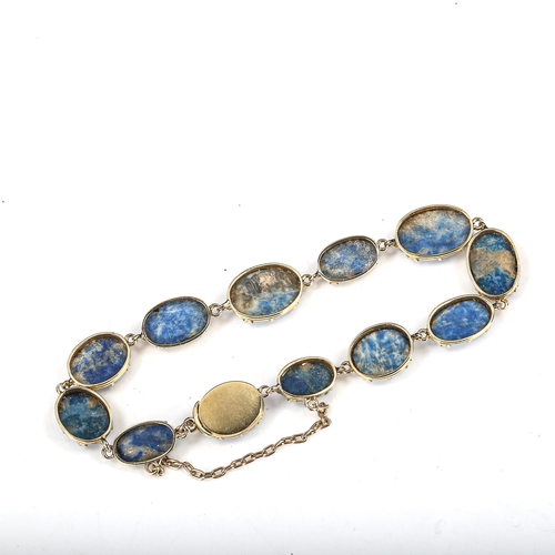 504 - A sodalite line bracelet, unmarked gold settings test as 18ct, bracelet length 18cm, 13.5g