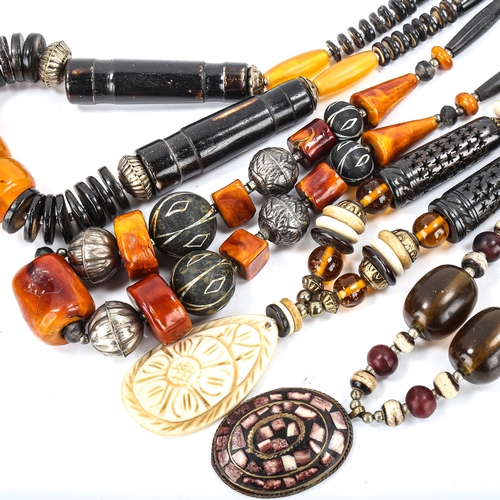 520 - A quantity of Tribal jewellery, including lacquer and bone