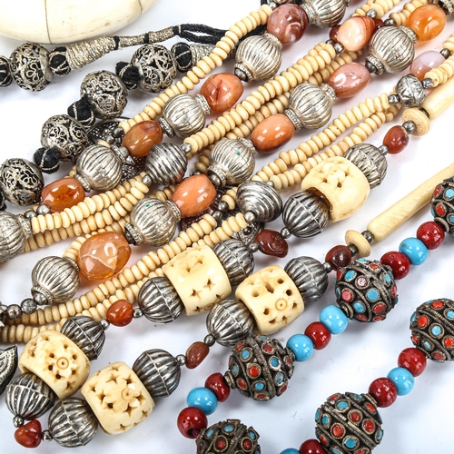 521 - A quantity of Eastern and Tribal jewellery, including agate bone etc