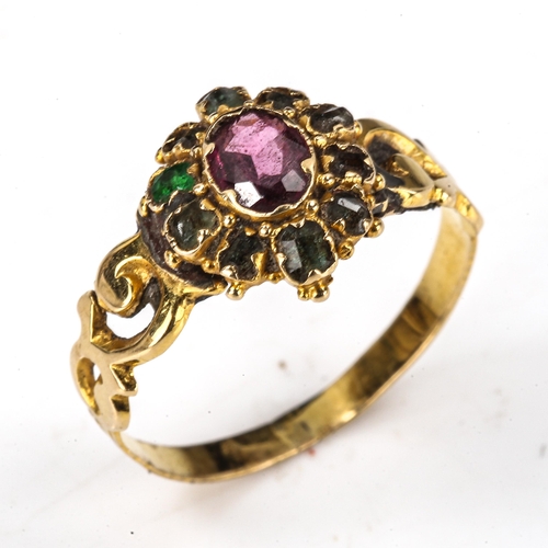 529 - A Victorian ruby and emerald cluster dress ring, pierced foliate shoulders with engraved shank, 12mm... 