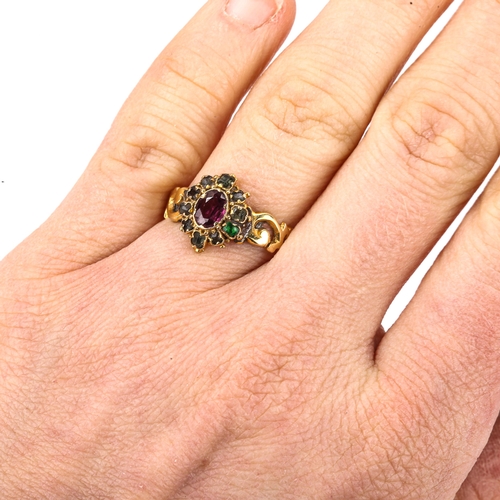 529 - A Victorian ruby and emerald cluster dress ring, pierced foliate shoulders with engraved shank, 12mm... 