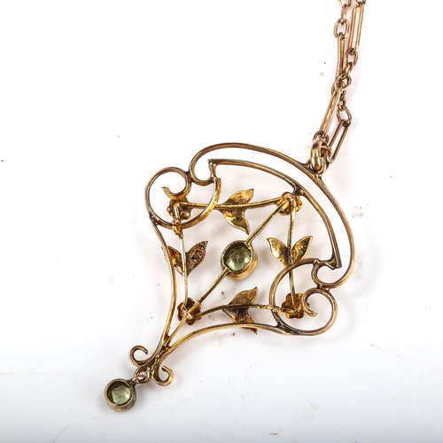 536 - An Edwardian 9ct gold peridot and pearl openwork pendant necklace, on unmarked yellow metal bar and ... 