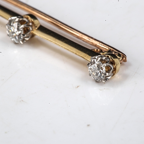 545 - An unmarked gold 3-stone diamond bar brooch, set with round brilliant-cut diamonds, total diamond co... 