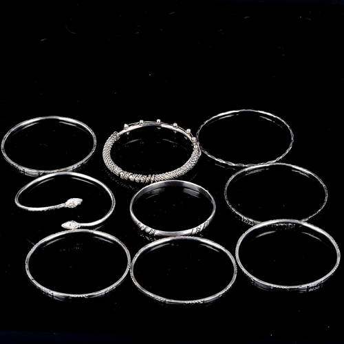 562 - 9 various silver bangles, 86.6g total (8)