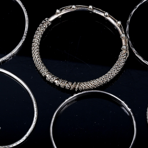 562 - 9 various silver bangles, 86.6g total (8)