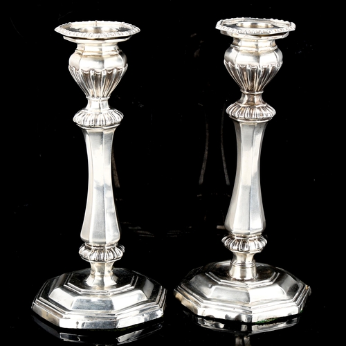 568 - A pair of late Victorian silver table candlesticks, by George Unite, hallmarks Birmingham 1899, heig... 