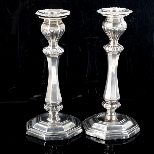 568 - A pair of late Victorian silver table candlesticks, by George Unite, hallmarks Birmingham 1899, heig... 