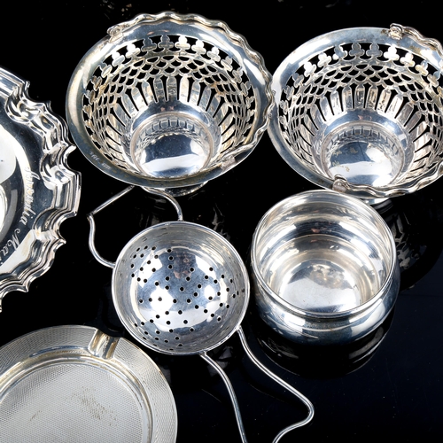 571 - Various silver, including tea strainer and stand, engine turned ashtray, pair of pierced baskets etc... 