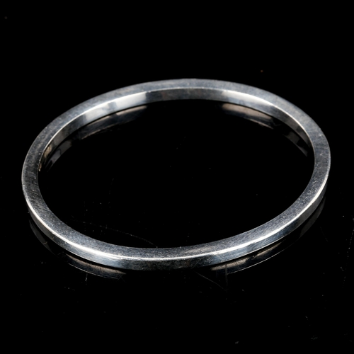 577 - A Danish stylised sterling silver plain form bangle, possibly Edward Aagaard, band width 3.9mm, inte... 