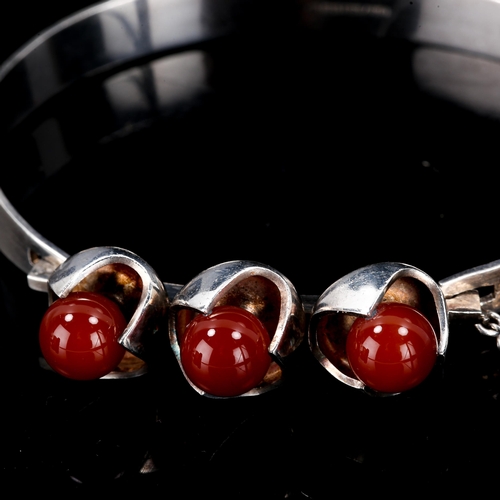 578 - SALOVAARA - a Vintage Finnish stylised sterling silver carnelian bead torque bracelet, Turku, bead d... 