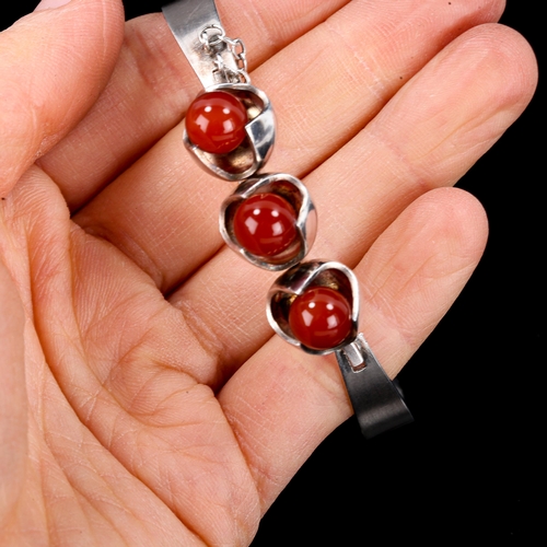 578 - SALOVAARA - a Vintage Finnish stylised sterling silver carnelian bead torque bracelet, Turku, bead d... 