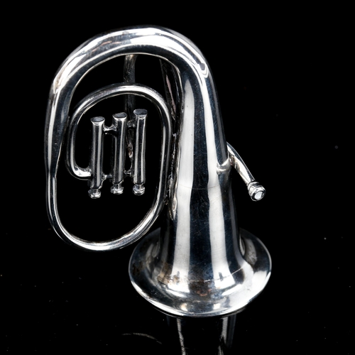 591 - A miniature Continental silver tuba instrument model, marked 835, length 6.5cm, 1.4oz, in fitted cas... 