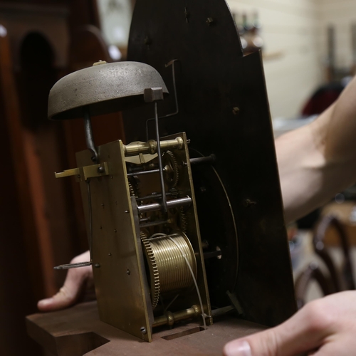 63 - JOHN WORSFOLD OF DORKING - an early 19th century flame mahogany 8-day longcase clock, arch-top brass... 