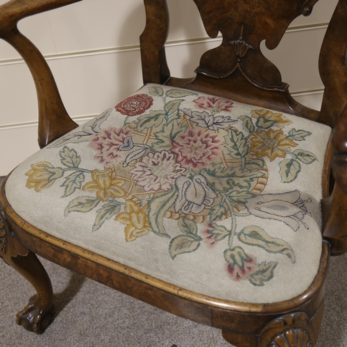 1072 - A fine 18th century walnut elbow chair in the manner of Giles Grendey, with relief carved urn-shaped... 