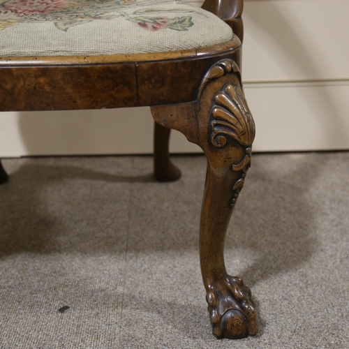 1072 - A fine 18th century walnut elbow chair in the manner of Giles Grendey, with relief carved urn-shaped... 