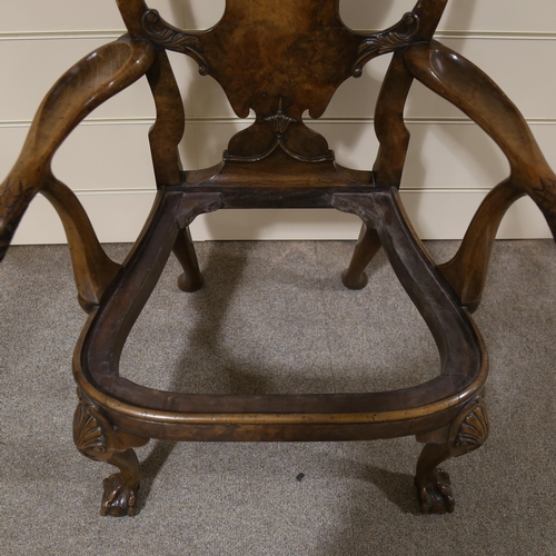 1072 - A fine 18th century walnut elbow chair in the manner of Giles Grendey, with relief carved urn-shaped... 