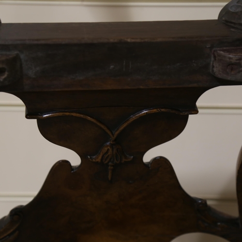 1072 - A fine 18th century walnut elbow chair in the manner of Giles Grendey, with relief carved urn-shaped... 