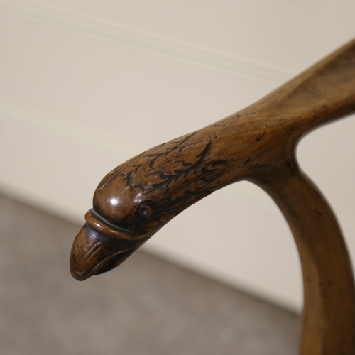 1072 - A fine 18th century walnut elbow chair in the manner of Giles Grendey, with relief carved urn-shaped... 