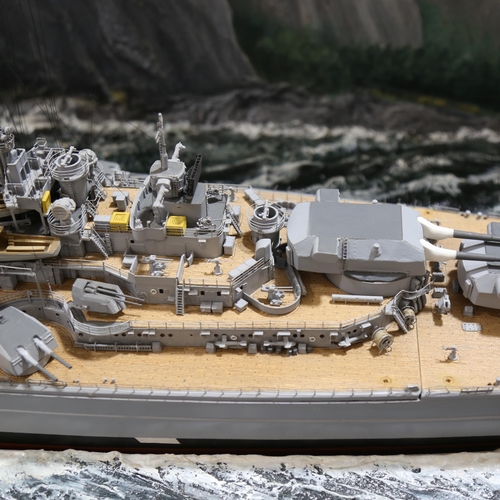 1287 - A large scale model of The Bismarck, in floor standing glazed wooden display case, 144cm