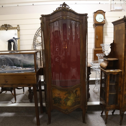 1288 - A French walnut and ormolu-mounted vitrine cabinet, with serpentine glass panels, and printed romant... 