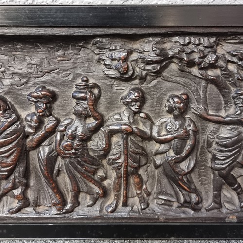 1001 - An 18th century relief carved oak wall plaque, depicting Noah's Ark, framed, overall 24cm x 82cm