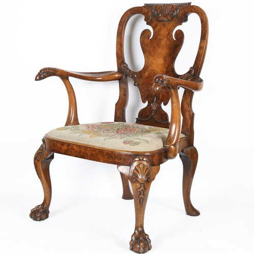 1072 - A fine 18th century walnut elbow chair in the manner of Giles Grendey, with relief carved urn-shaped... 