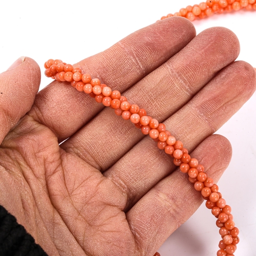 241 - A coral bead torsarde necklace, with unmarked yellow metal clasp, necklace length 40cm, 20.4g