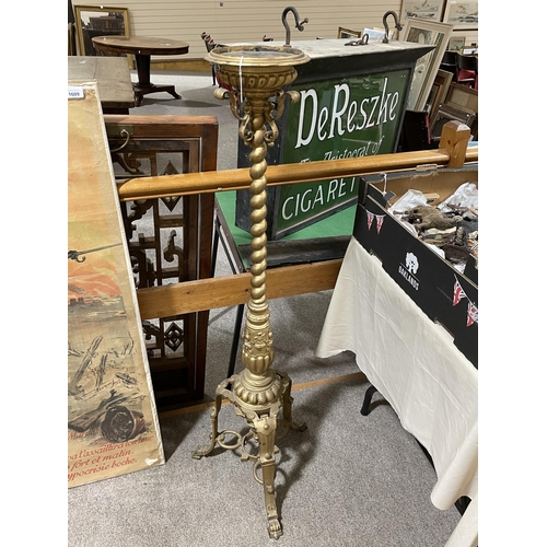 1015 - A 19th century cast bronze torcher stand, with spiral twist centre column and tripod base, height 12... 