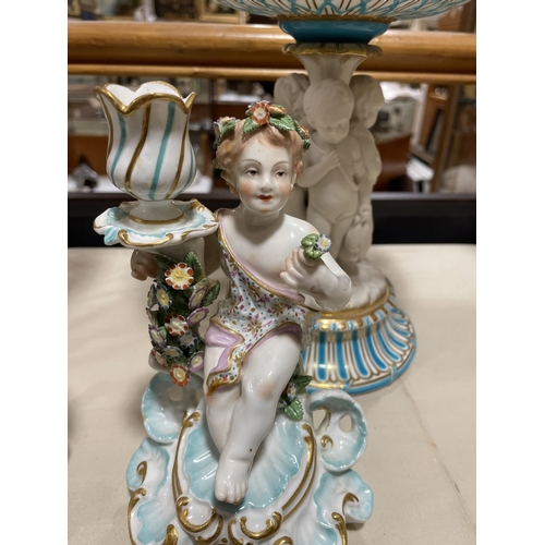 1296 - A pair of 19th century porcelain candlesticks, supported by putti figures, gold anchor marks, height... 