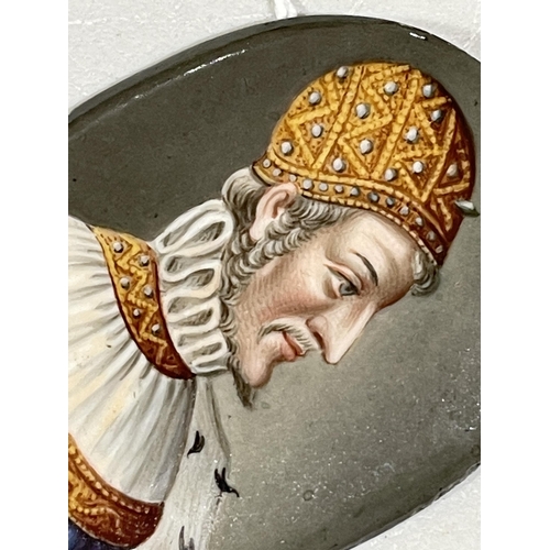 1310 - A 19th century painted porcelain plaque, depicting a Medieval bishop, 5.5cm x 4.5cm