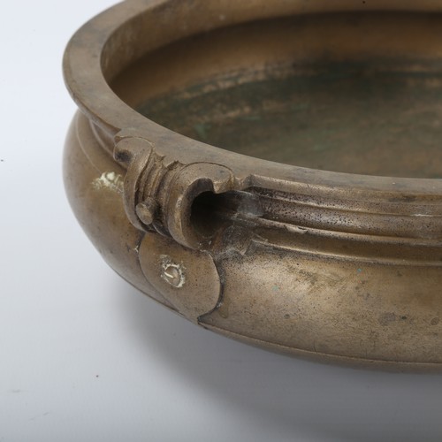 1291 - A Chinese bronze incense burner with ring handles, diameter 21cm