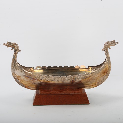 1292 - A Scandinavian electroplate table centre bowl, in the form of a Viking longboat, on hardwood stand, ... 