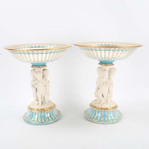 1294 - A pair of 19th century porcelain tazza, supported by bisque porcelain figures of children, turquoise... 