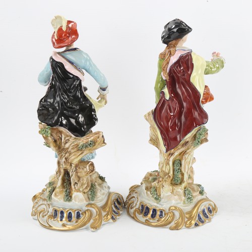 1295 - A pair of porcelain romantic figures, red anchor marks, height 29cm