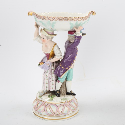 1298 - A Meissen porcelain comport, supported by children figures, height 19cm