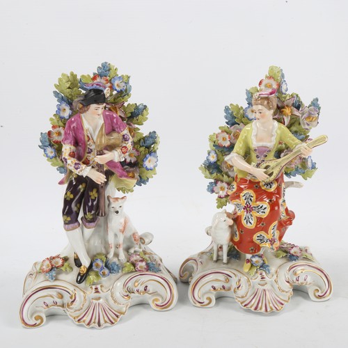 1297 - A pair of porcelain musician figures, with gold anchor marks, height 22cm