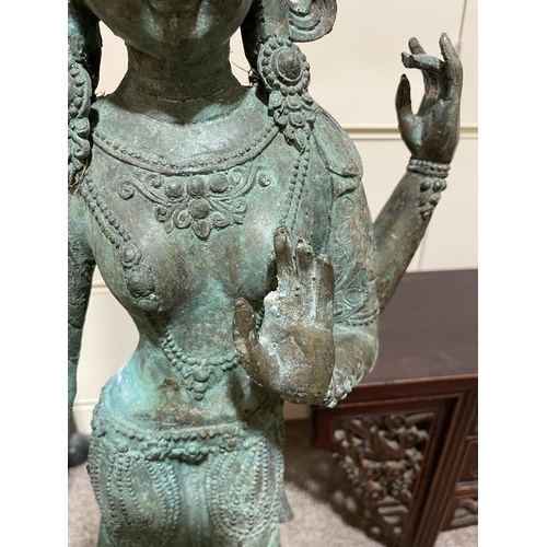 1130 - A large Indian verdigris bronze standing Buddha, height 73cm