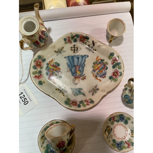 1250 - A Chinese famille rose porcelain doll's tea service on matching tray, tray length 14cm