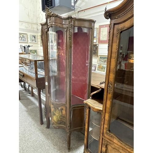 1288 - A French walnut and ormolu-mounted vitrine cabinet, with serpentine glass panels, and printed romant... 