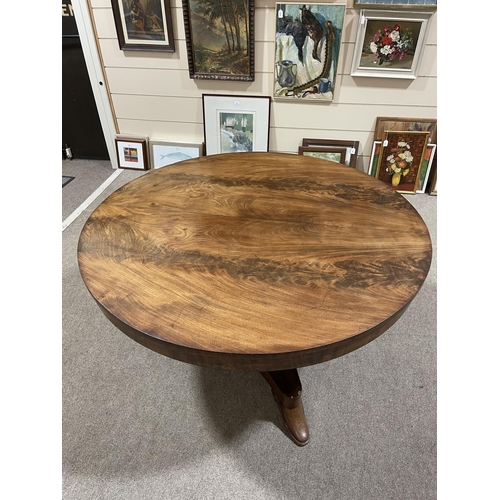 1313 - A 19th century Manx circular mahogany tilt-top dining table on stylised platform base, diameter 125c... 