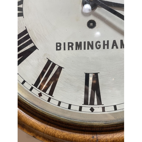 76 - A light oak-cased 30-hour circular dial wall clock, by Swinden & Sons of Birmingham, white enamel di... 