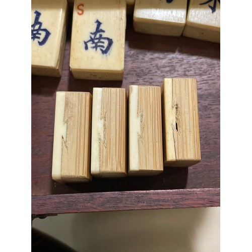 1227 - A Chinese bone and bamboo Mahjong set, in original brass-bound hardwood cabinet, with brass carrying... 