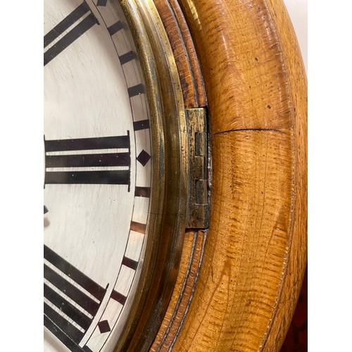 76 - A light oak-cased 30-hour circular dial wall clock, by Swinden & Sons of Birmingham, white enamel di... 