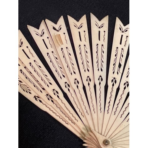 1185 - A 19th century hand painted ivory fan, length 18.5cm, and a bone arrow design fan with pierced decor... 