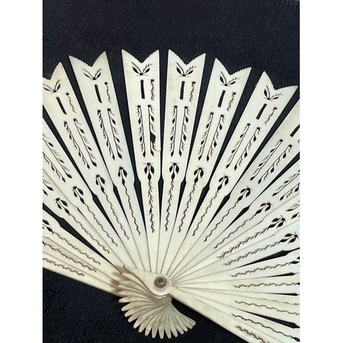 1185 - A 19th century hand painted ivory fan, length 18.5cm, and a bone arrow design fan with pierced decor... 